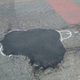 Illustration for article titled Spraypainting Phalluses On Potholes Is One Way To Get Them Fixed